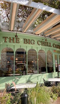 the big chilli cafe is green and white