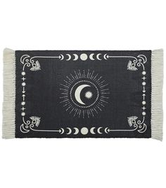 a black and white rug with an image of the moon