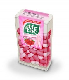 a box filled with pink and white candies