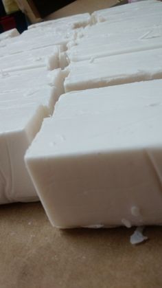 several pieces of white soap sitting on top of a counter