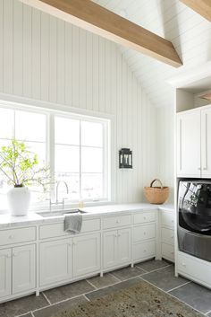 a washer and dryer in a white kitchen