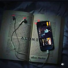 an open book with headphones attached to it and the text silent hackr on top