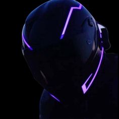 a person wearing a helmet with purple neon lights on it's face and head