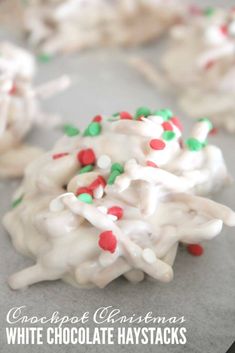 white chocolate haystacks with candy sprinkles are on a baking sheet