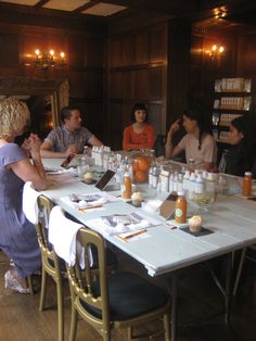 a group of people sitting around a table