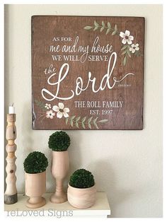 a wooden sign that says as for me and my house we will serve the lord