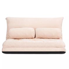 a white couch with pillows on it and a black frame around the back end, in front of a white background