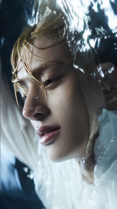 a woman is submerged in clear water