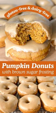 pumpkin donuts with brown sugar frosting are on a cooling rack and there is a bite taken out of one