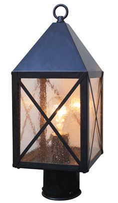 an outdoor light with a blue top and clear glass on the bottom, hanging from a black post