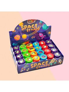 an open box of space station toys on a pink and orange background with the words space station above it