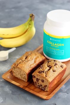 banana and chocolate chip muffins on a cutting board next to a jar of collagen