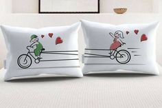 two white pillows with cartoon characters on them