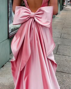 Prom Dress With Big Bow, Pink Dress With Bow On Back, Pink Satin Bridesmaid Dress For Banquet, Sleeveless Wedding Dress With Bow, Sleeveless Pink Satin Gown, Pink Sleeveless Satin Gown, Pink Satin Dress With Bow Tie Back, Sleeveless Gown With Bow, Pink Satin Maxi Dress For Banquet