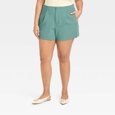 Create an array of cool and confident warm-weather looks with these High-Rise Tailored Shorts from A New Day™. Made from lightweight fabric with a hint of spandex, these high-rise shorts offer all-day cool comfort and easy movement. Designed with a fly hook and zipper, they feature two side pockets to add functional flair to your look, while the solid hue makes for easy pairing with different tops. A New Day™: Style that goes wherever you do. Spring High-waisted Stretch Shorts, Spring Stretch High-waisted Shorts, Non-stretch Green Shorts For Spring, Stretch Knee-length Shorts For Day Out, Casual Stretch Workwear Shorts, Summer Pants With 5-inch Inseam, Casual 5-inch Inseam Shorts For Spring, Casual Shorts With 5-inch Inseam For Spring, Summer Stretch Pants With 5-inch Inseam