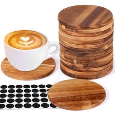 a stack of wooden coasters next to a cup of coffee