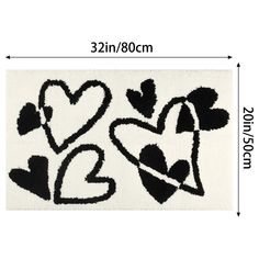 black and white rug with hearts in the middle, on top of a white background