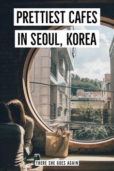 a woman sitting in front of a round window with the words prettiest cafes in seoul, korea