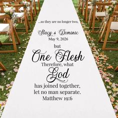 a wedding aisle decorated with white flowers and black lettering that reads, they are no longer loved