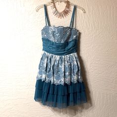 Betsey Johnson Formal Cocktail Dress Pale Teal Blue Lace Tiered With Sash And Large Bow In Back Size 2. Extremely Gorgeous With Floral Lace And Embroidered Flowers On Top Of Lace In Bust Area. Hidden Side Zipper. You Can Wear With Or Without The Straps. Dry Clean Only. Waist 26 Inch. Bust 28”. Bust Area 8 Inches And Waist To Bottom Hem 18 Inches. Maybe Worn Once, In Very Good Condition. Betsey Items, Especially More Couture Run Small. Same Dress Listing At 450.00 And That Is More Mid Range For Her Formals. Since Betsey Retired They Just Don’t Make Them As Well Crafted In Past. Also The Blue Leans Toward Hint Of Green. Thank You For Checking Out This Beauty ! Formal Cocktail Dress, Betsey Johnson Dresses, Large Bow, Book Decor, Blue Lace, Embroidered Flowers, Teal Blue, Betsey Johnson, Floral Lace