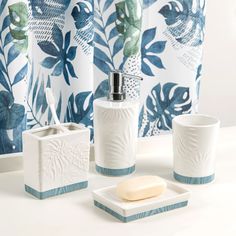 bathroom accessories including soap dispenser and toothbrush holder