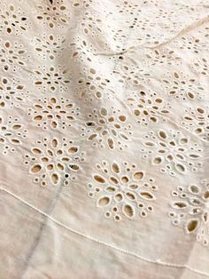 an old table cloth with crocheted doily on it