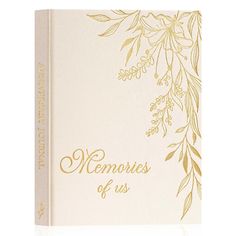 a white book with gold lettering that reads memories of us on the front and side