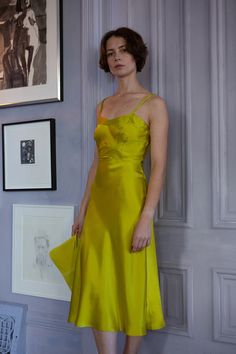 Our best-selling and most renowned essential slip dress, now in a longer below-knee length and envisioned in fluid chartreuse silk charmeuse. Lola is bias-cut and french seamed with all the vintage detailing of an heirloom silk slip. With classic bodice seams that provide structure with ease, the Lola is designed for an exquisite perfect fit. Versatile enough to wear from day to night, with or without a bra. With an elegant fit designed for elevated occasions, this Lola falls mid calf. The Lola Chartreuse Wedding Dress, Chartreuse Dress Wedding, Chic Yellow Evening Slip Dress, Chartreuse Evening Dress, Chartreuse Outfit, Chartreuse Party Dress, Chartreuse Midi Dress, Chartreuse Silk Robe, Chartreuse Dress