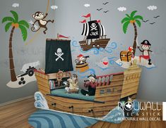 a pirate ship wall mural in a child's room with wooden floors and walls