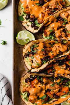 chicken tacos with black beans, avocado and cilantro sauce