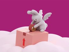 a small white toy sitting on top of a pink box with an arrow pointing to it