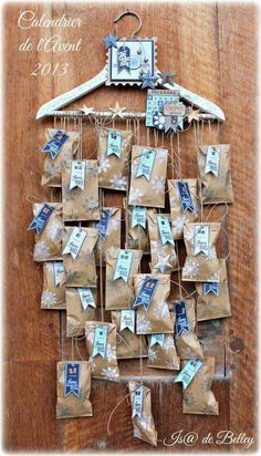 a wooden table topped with lots of small pieces of fabric covered in blue and white