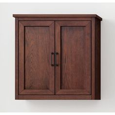 a wooden cabinet hanging on the wall