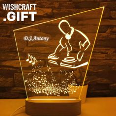 a light up music player with headphones on and the words wishcraft i gift