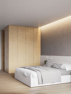 a bed sitting in the middle of a bedroom next to a wooden wall