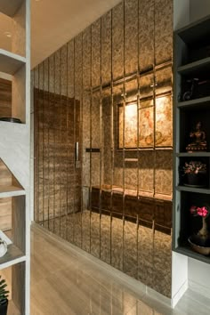 the interior of a modern home with mirrored walls and shelves filled with vases, bookshelves and other decorative items