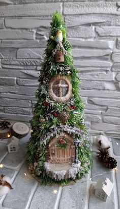 a small christmas tree with a clock on it