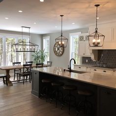 a large kitchen with an island in the middle