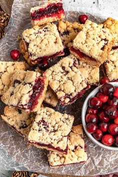 cranberry bars and cherries on a plate