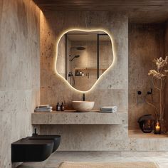 a bathroom with a sink, mirror and lights on the wall above it's counter