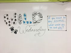 a white board with writing on it that says wild wednesday and an animal paw print