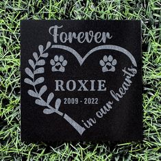 a personalized memorial plaque in the grass