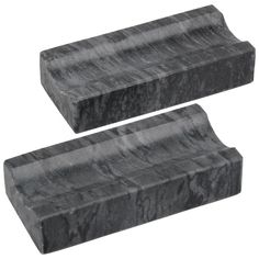 two black marble blocks sitting next to each other