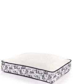 an image of a dog bed with white and black print on it's sides