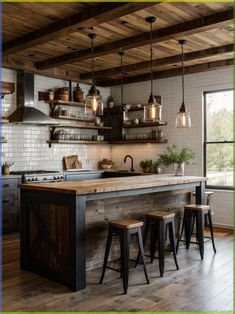 an industrial style kitchen with wooden counters and stools in the center, surrounded by hanging lights