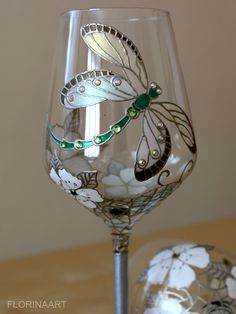 a wine glass sitting on top of a wooden table