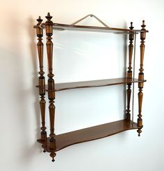 a wooden shelf with two shelves on it