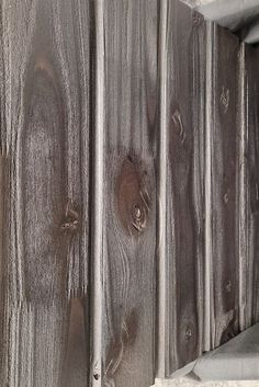 an old wooden door with peeling paint on it