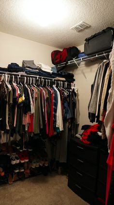 a closet filled with lots of clothes and shoes