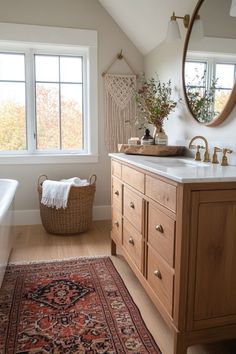 a bathroom with a rug, sink and mirror